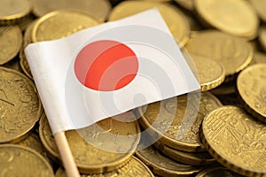 Japan flag on coins money, finance and accounting, banking concept