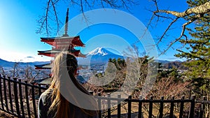 Japan - A girl admiring with Chuerito Pagoda and Mt Fuji in the back