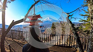 Japan - A girl admiring with Chuerito Pagoda and Mt Fuji in the back