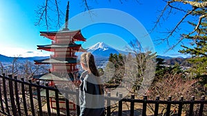 Japan - A girl admiring with Chuerito Pagoda and Mt Fuji in the back