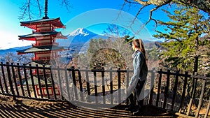 Japan - A girl admiring with Chuerito Pagoda and Mt Fuji in the back