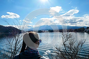 Japan - A girl admiring Mt Fuji from Kawaguchiko Lake