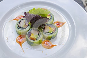 Japan gourmet cuisine - closeup and detail on delicious and delicate dish of Japanese sushi rolls in traditional healthy Asian