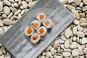 Japan gourmet cuisine -  delicious and delicate dish of Japanese sushi rolls in slate on stone background in traditional healthy