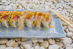 Japan gourmet cuisine -  delicious and delicate dish of Japanese sushi rolls in slate on stone background in traditional healthy