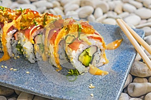 Japan gourmet cuisine -  delicious and delicate dish of Japanese sushi rolls in slate on stone background in traditional healthy