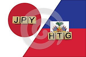 Japan and Haiti currencies codes on national flags background