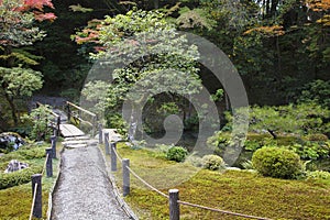 Japan Kyoto Tenju-an Temple garden with footpath and bridge