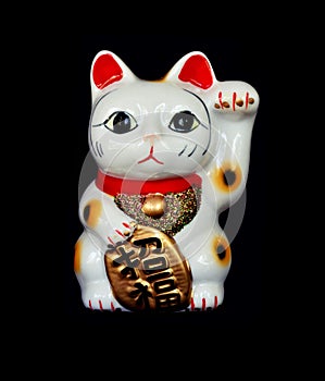 Japan lucky cat on black background