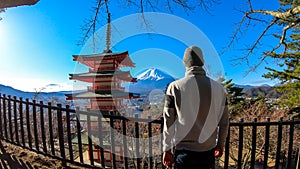 Japan - A man admiring with Chuerito Pagoda and Mt Fuji in the back