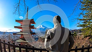 Japan - A man admiring with Chuerito Pagoda and Mt Fuji in the back