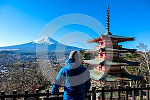 Japan - A man admiring with Chuerito Pagoda and Mt Fuji in the back