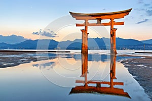 Japan. Miyajima. Hiroshima. Itsukushima Shrine and floating torii gate at sunset