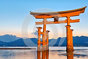 Japan. Miyajima. Hiroshima. Itsukushima Shrine and floating torii gate at sunset