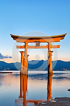 Japan. Miyajima. Hiroshima. Itsukushima Shrine and floating torii gate at sunset