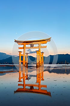 Japan. Miyajima. Hiroshima. Itsukushima Shrine and floating torii gate at sunset