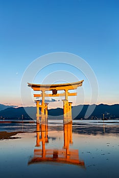 Japan. Miyajima. Hiroshima. Itsukushima Shrine and floating torii gate at sunset