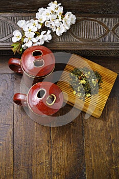 Japan's tea cups with green tea and sakura flowers