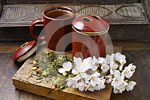 Japan's tea cups with green tea and sakura flowers