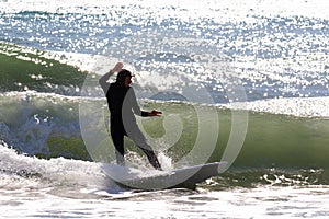 Japan Surf, a man surf many waves on many Surf boards during sunrise and sunset in a blue ocean. Surfing In Japan