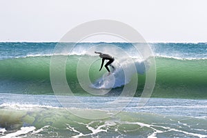 Japan Surf, a man surf many waves on many Surf boards during sunrise and sunset in a blue ocean. Surfing In Japan