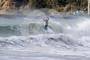 Japan Surf, a man surf many waves on many Surf boards during sunrise and sunset in a blue ocean. Surfing In Japan