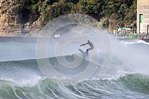 Japan Surf, a man surf many waves on many Surf boards during sunrise and sunset in a blue ocean. Surfing In Japan