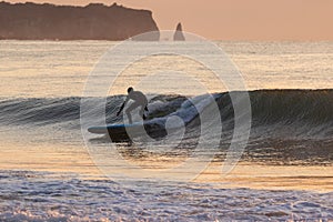 Japan Surf, a man surf many waves on many Surf boards during sunrise and sunset in a blue ocean. Surfing In Japan