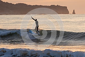 Japan Surf, a man surf many waves on many Surf boards during sunrise and sunset in a blue ocean. Surfing In Japan