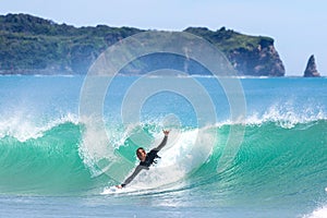 Japan Surf, a man surf many waves on many Surf boards during sunrise and sunset in a blue ocean. Surfing In Japan