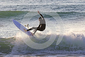 Japan Surf, a man surf many waves on many Surf boards during sunrise and sunset in a blue ocean. Surfing In Japan