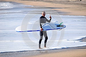 Japan Surf, a man surf many waves on many Surf boards during sunrise and sunset in a blue ocean. Surfing In Japan