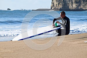 Japan Surf, a man surf many waves on many Surf boards during sunrise and sunset in a blue ocean. Surfing In Japan