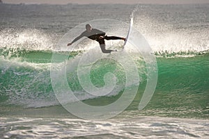 Japan Surf, a man surf many waves on many Surf boards during sunrise and sunset in a blue ocean. Surfing In Japan