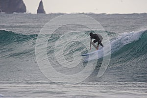 Japan Surf, a man surf many waves on many Surf boards during sunrise and sunset in a blue ocean. Surfing In Japan