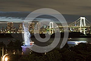 Japan, Tokyo, night view of the bay with its bridge and Statue of Liberty