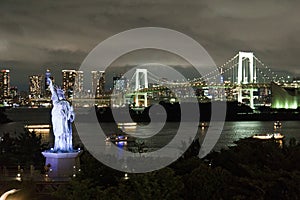 Japan, Tokyo, night view of the bay with its bridge and Statue of Liberty