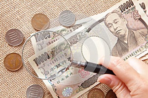 Japan Yen Money with magnifying glass photo