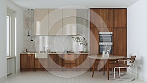 Japandi trendy wooden kitchen and dining room in white and beige tones. Wooden cabinets, table, contemporary wallpaper and marble