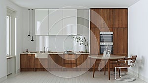 Japandi trendy wooden kitchen and dining room in white and beige tones. Wooden cabinets, table and marble top. Minimalist interior