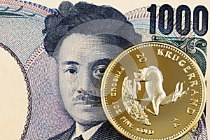 Japanese 1000 yen bank note with a gold Krugerrand coin