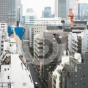 Japanese abstract urban background featuring details of chaotic city buildings and skyline in Tokyo