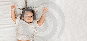 Japanese Baby Girl Lying Raising Hands On White Blanket Indoor