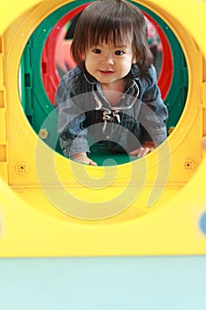 Japanese baby girl passing through a tunnel