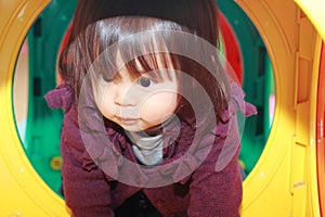 Japanese baby girl passing through a tunnel