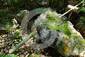 A Japanese Bamboo Water Fountain Shishi-Odoshi in Zen Garden