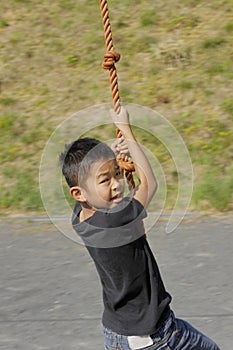 Japanese boy playing with flying fox