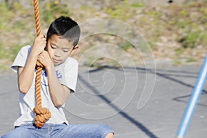 Japanese boy playing with flying fox