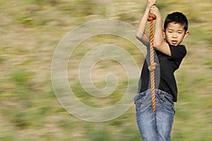 Japanese boy playing with flying fox