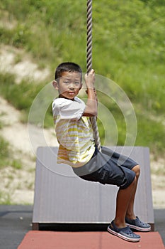 Japanese boy playing with flying fox